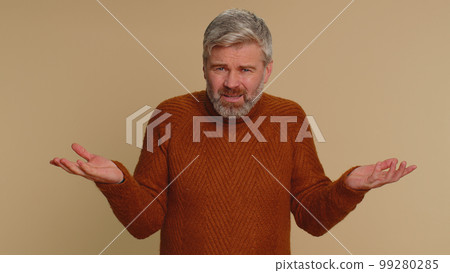 Man raising hands in indignant expression ask why what reason of failure demonstrating disbelief 99280285