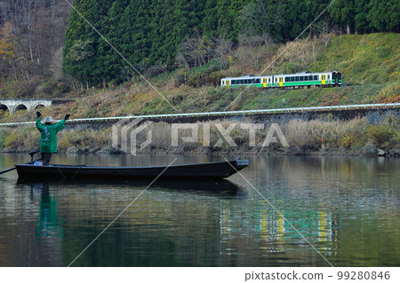 Mugenkyo ferry and Tadami Line The boatman waving at the train and the train whistle responding Mugenkyo ferry and Tadami Line The boatman waving at the train and the train whistle responding 99280846