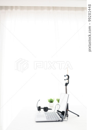 Indoor white table, laptop, smartphone, headphones, foliage plants Indoor white table, laptop, smartphone, headphones, foliage plants 99281448