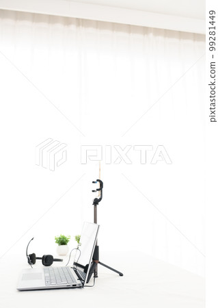 Indoor white table, laptop, smartphone, headphones, foliage plants Indoor white table, laptop, smartphone, headphones, foliage plants 99281449