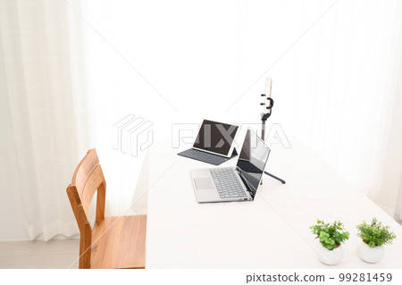 Indoor white table, laptop, smartphone, tablet, foliage plants Indoor white table, laptop, smartphone, tablet, foliage plants 99281459
