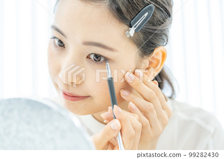 Beauty Beauty Close-up of a young woman's face with eyeliner Beauty Beauty Close-up of a young woman's face with eyeliner 99282430