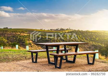 Public picnic table with McLaren Vale vineyards in the background Public picnic table with McLaren Vale vineyards in the background 99282730