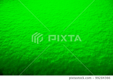 Colored snow as a background. Green background. Colored snow as a background. Green background. 99284366