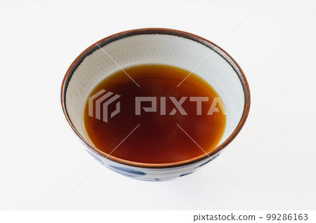 Warm soy sauce flavored soup on white background 99286163