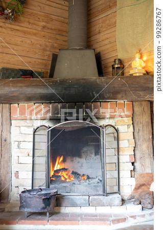 fireplace in mountain hut fireplace in mountain hut 99286767