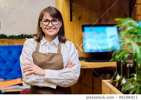 Portrait of middle aged confident woman restaurant owner 99286921