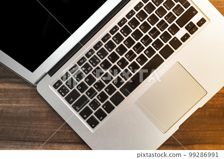 Keyboard laptop table workspace empty workplace job work business blank wooden desk modern background Keyboard laptop table workspace empty workplace job work business blank wooden desk modern background 99286991