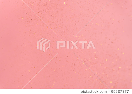 pink abstract background with flying gold sequins pink abstract background with flying gold sequins 99287577