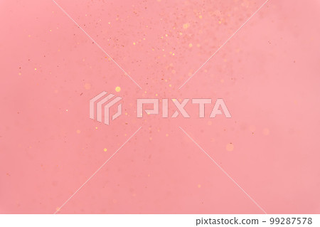 pink abstract background with flying gold sequins pink abstract background with flying gold sequins 99287578