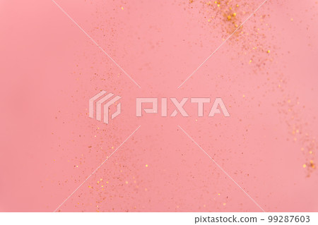 pink abstract background with flying gold sequins pink abstract background with flying gold sequins 99287603