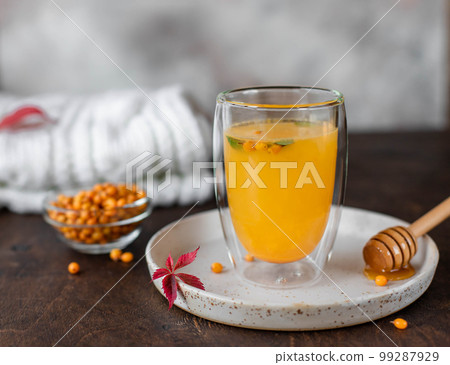 Sea buckthorn hot tea with mint and honey. herbal vitamin tea.  99287929