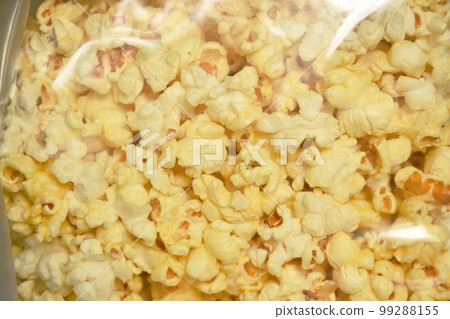 salty popcorn in clear plastic packaging on white background salty popcorn in clear plastic packaging on white background 99288155