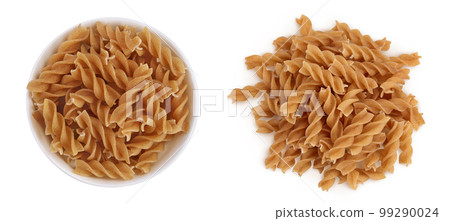 Wolegrain fusilli pasta from durum wheat in ceramic bowl isolated on white background with full depth of field. Top view. Flat lay. 99290024