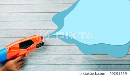Happy songkran day festival at Thailand. water gun shoot water splash drawing empty space for text isolated on blue wooden background, traditional Thai New Year, Web banner design Happy songkran day festival at Thailand. water gun shoot water splash drawing empty space for text isolated on blue wooden background, traditional Thai New Year, Web banner design 99291339