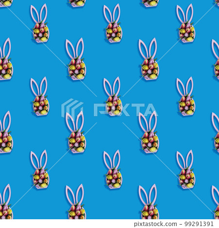 Creative seamless pattern with easter bunny statuette and spring tulips on blue background, easter minimal concept 99291391