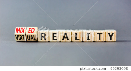 Mixed or virtual reality symbol. Concept words Mixed reality Virtual reality on wooden cubes. Beautiful grey table grey background. Business mixed or virtual reality concept. Copy space. 99293098