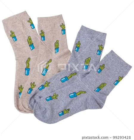 Two pairs of socks with drawings of many green cacti in flowerpots, lie side by side, isolate Two pairs of socks with drawings of many green cacti in flowerpots, lie side by side, isolate 99293428