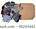 Striped socks folded in half and laid out in a circle in a pizza box, concept, on a white background 99293442