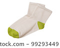 A pair of beige women's socks with green toes and heels, lie one on top of the other, flat lay 99293449