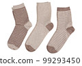 Three pairs of socks, with and without stripes, in a row, on a white background 99293450