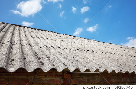 Picture of a roof made of carcinogenic asbestos tiles, selective focus. 99293749