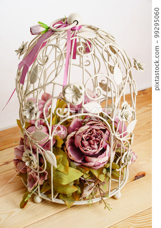 decorative cage with a composition of artificial flowers. decorative cage with a composition of artificial flowers. 99295060