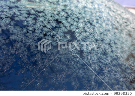 Frost crystals on car windshield Frost crystals on car windshield 99298330