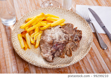 Fried pork with potatoes 99299210