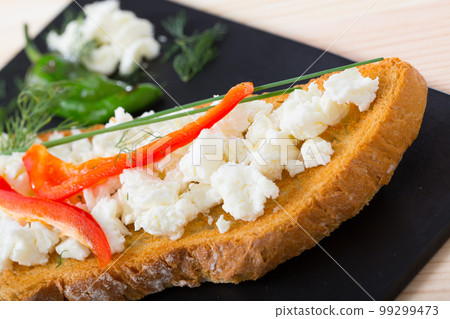 Canape with young cheese and pepper Canape with young cheese and pepper 99299473