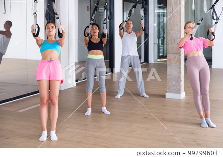 People training trx pilates at group class 99299601