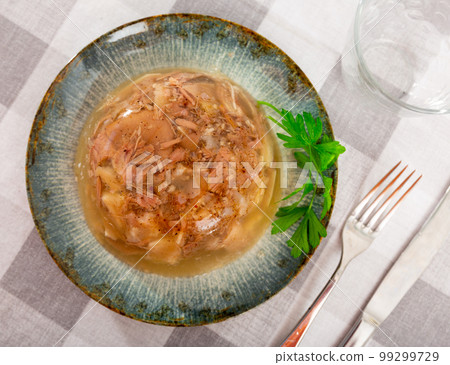 Traditional russian dish kholodets served on plate Traditional russian dish kholodets served on plate 99299729