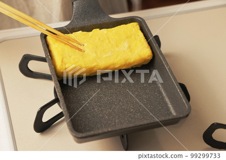 Tamagoyaki being cooked in the kitchen Tamagoyaki being cooked in the kitchen 99299733