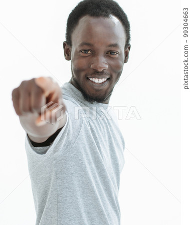 young man in a white t-shirt points at you. young man in a white t-shirt points at you. 99304663