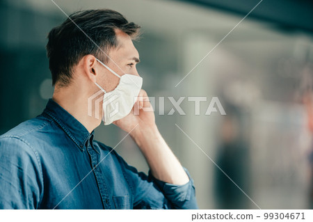 close up. casual young man in a protective mask on a city street 99304671
