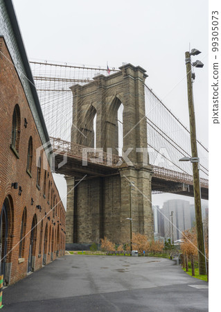 Brooklyn Bridge view from Brooklyn Dumbo neighbourhood in New York City ,USA Brooklyn Bridge view from Brooklyn Dumbo neighbourhood in New York City ,USA 99305073