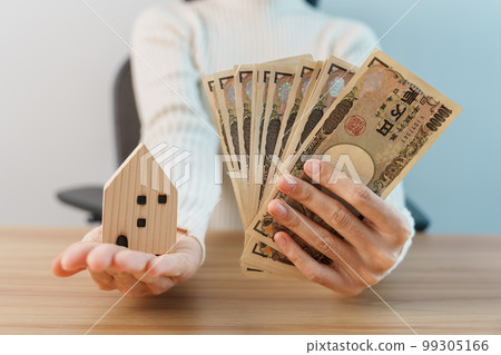 Woman holding Japanese Yen banknote and House model. Real Estate, Home, Mortgage, Japan cash, Tax, Recession Economy, Inflation, Investment, finance and savings concepts 99305166