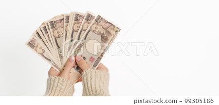 Woman hand holding Japanese Yen banknote stack. Thousand Yen money. Japan cash, Tax, Recession Economy, Inflation, Investment, finance and shopping payment concepts Woman hand holding Japanese Yen banknote stack. Thousand Yen money. Japan cash, Tax, Recession Economy, Inflation, Investment, finance and shopping payment concepts 99305186