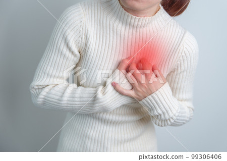 woman hand holding chest ache. Heart disease, angina disease and symptom heart attack disease Cardiovascular, Atherosclerosis, Hypertensive world Heart day and health concept 99306406