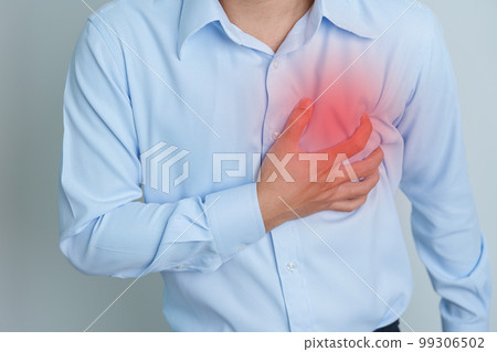 man hand holding chest ache. Heart disease, angina disease and symptom heart attack disease Cardiovascular, Atherosclerosis, Hypertensive world Heart day and health concept 99306502