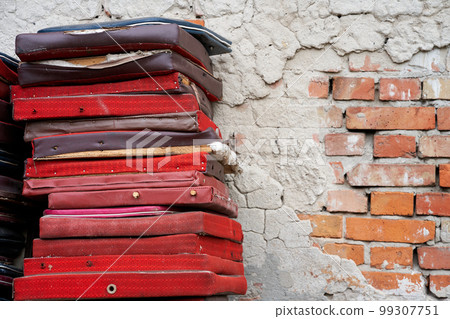 Bunch of old broken chair seats on backyard of theatre Bunch of old broken chair seats on backyard of theatre 99307751