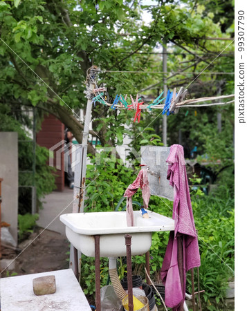 oddly open washstand on the backyard or country house 99307790