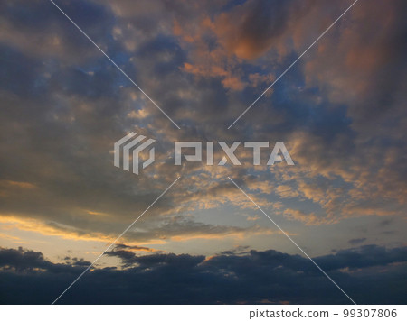 incredible blue and golden sunset landscape heavy clouds 99307806