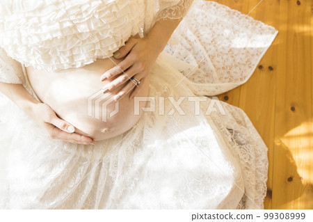The belly of a pregnant woman who is about to give birth 99308999