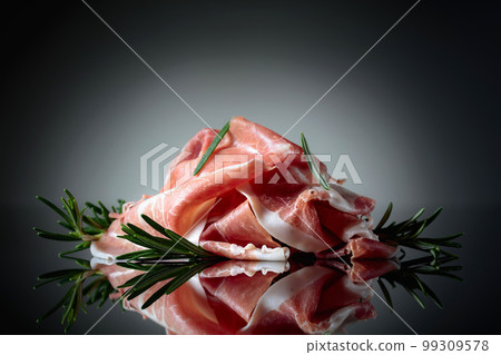 Italian prosciutto or Spanish jamon with rosemary. 99309578