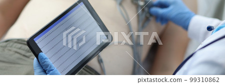 ECG or EKG of heart on tablet of person with electrodes for recording electrocardiogram on bed in hospital ECG or EKG of heart on tablet of person with electrodes for recording electrocardiogram on bed in hospital 99310862