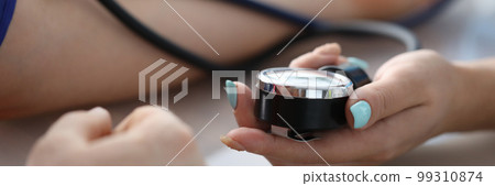 Female doctor hands male patient blood pressure measurement Female doctor hands male patient blood pressure measurement 99310874