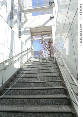 Scenery looking up at the exit from the stairs of the underpass Scenery looking up at the exit from the stairs of the underpass 99313064