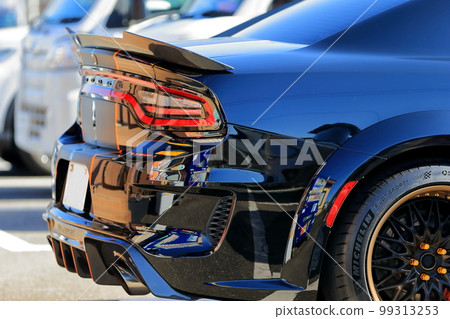 Image of a sports car in a parking lot Image of a sports car in a parking lot 99313253
