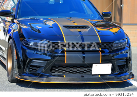 Image of a sports car in a parking lot Image of a sports car in a parking lot 99313254